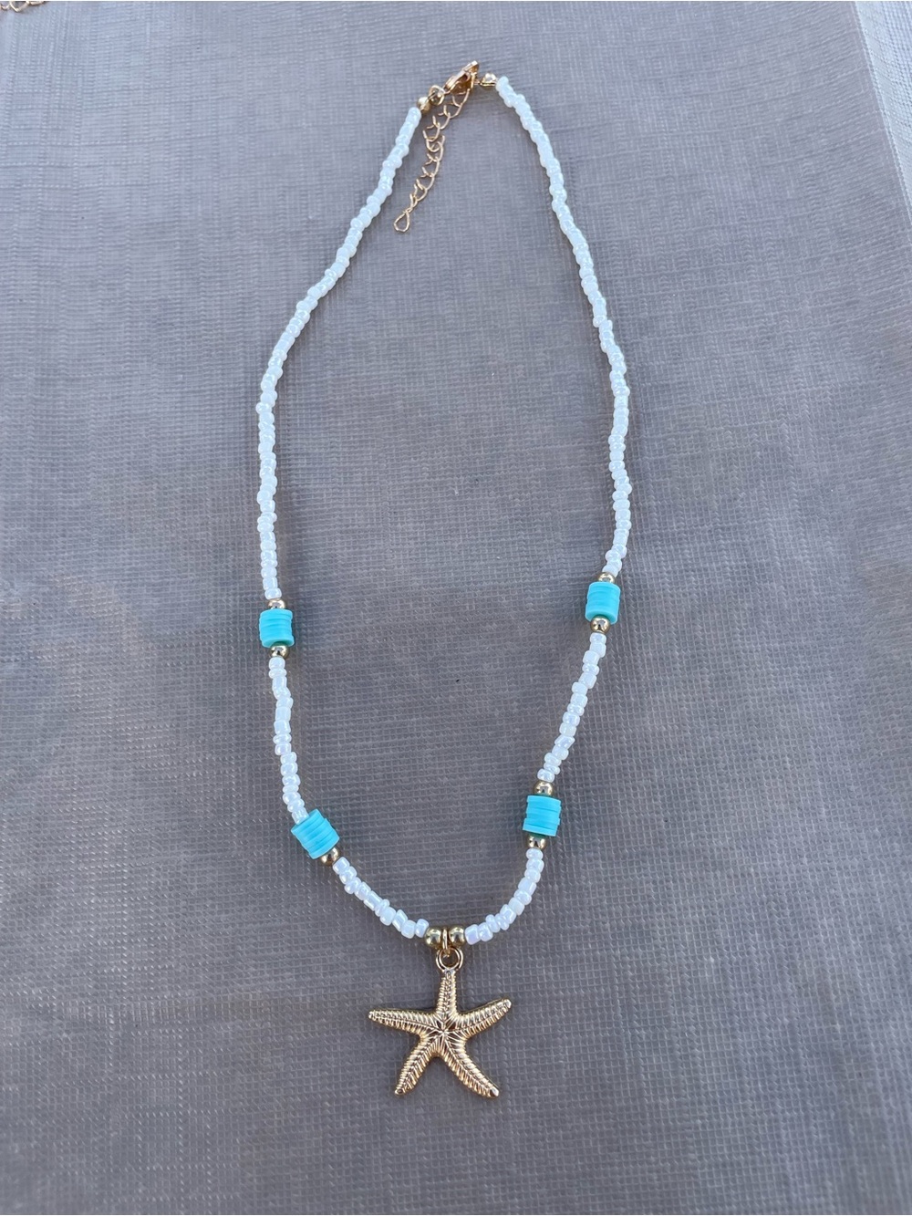 White and Turquoise Beaded Necklace with Gold Starfish Pendant